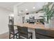 Modern kitchen with butcher block countertops, stainless steel appliances, and white shaker cabinets at 6297 29Th N St, St Petersburg, FL 33702