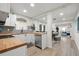 Open concept kitchen with island and view into living area at 6297 29Th N St, St Petersburg, FL 33702