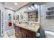 Elegant bathroom with granite countertops and a stone accent wall at 6332 Newtown Cir # 32A1, Tampa, FL 33615