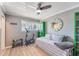 Bright bedroom with a daybed, exercise bike and built-in shelving at 6332 Newtown Cir # 32A1, Tampa, FL 33615