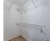 Functional closet with wire shelving and hanging rods at 6332 Newtown Cir # 32A1, Tampa, FL 33615