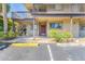 Condo building exterior featuring a walkway, stairs, and parking at 6332 Newtown Cir # 32A1, Tampa, FL 33615