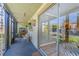 Screened lanai with glass sliding doors leading to the outdoors at 6332 Newtown Cir # 32A1, Tampa, FL 33615