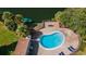 Community pool and deck overlooking a canal, perfect for relaxation at 6332 Newtown Cir # 32A1, Tampa, FL 33615