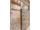 Walk-in shower with stone wall and pebble floor at 6332 Newtown Cir # 32A1, Tampa, FL 33615