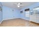 Light blue bedroom with hardwood floors and white dresser at 6723 Basswood Cir, Zephyrhills, FL 33542