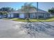 Exterior of home with garage and landscaping at 6723 Basswood Cir, Zephyrhills, FL 33542