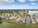 Aerial view of houses near a lake, showing a quiet neighborhood at 6820 Aramon Ct, Wesley Chapel, FL 33545