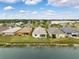 Aerial view of houses on the lake at 6820 Aramon Ct, Wesley Chapel, FL 33545