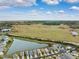 Aerial view of homes near a lake and conservation area at 6820 Aramon Ct, Wesley Chapel, FL 33545