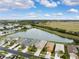 Aerial view of homes near a lake and conservation area at 6820 Aramon Ct, Wesley Chapel, FL 33545