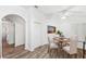 Dining area with hardwood floors and a view into the kitchen at 6820 Aramon Ct, Wesley Chapel, FL 33545