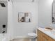 Modern bathroom with gray tile, a white vanity, and a bathtub at 7231 Woodbrook Dr, Tampa, FL 33625