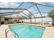 Large, refreshing pool with screened enclosure and plenty of room for lounging at 807 Lenna Ave, Seffner, FL 33584