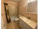 Clean bathroom with a shower/tub combo and vanity at 883 Sky Loch S Dr, Dunedin, FL 34698