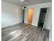 Bright bedroom with wood-look flooring and ceiling fan at 883 Sky Loch S Dr, Dunedin, FL 34698