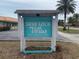 Skye Loch Villas 55+ community sign at 200 Patricia Ave at 883 Sky Loch S Dr, Dunedin, FL 34698