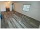 Spacious living area with wood-look vinyl flooring at 883 Sky Loch S Dr, Dunedin, FL 34698
