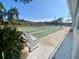 Community shuffleboard court with benches and landscaping at 883 Sky Loch S Dr, Dunedin, FL 34698