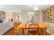 Bright dining area with wooden table and four chairs at 10172 Seminole Island Dr, Largo, FL 33773