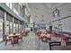 Bright and airy community restaurant with tables and chairs at 102 Cambridge Trl # 225, Sun City Center, FL 33573