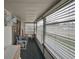Enclosed patio with seating and window blinds at 102 Cambridge Trl # 225, Sun City Center, FL 33573