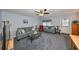 Living room with seating area and carpet at 102 Cambridge Trl # 225, Sun City Center, FL 33573