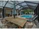 Relaxing pool area with dining and lounge furniture at 109 Peterson Ln, Palm Harbor, FL 34683