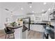 Modern white kitchen with stainless steel appliances at 10904 Highview Dr, Dade City, FL 33525