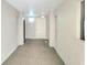 Building hallway with carpet and exit sign at 1400 1St W Ave # 306, Bradenton, FL 34205