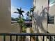 Hallway view with tropical plants and building exterior at 1400 1St W Ave # 306, Bradenton, FL 34205