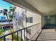 Building hallway with view of tropical landscaping at 1400 1St W Ave # 306, Bradenton, FL 34205