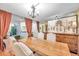 Bright dining room featuring a large wooden table and seating for four at 1550 S Belcher Rd # 117, Clearwater, FL 33764