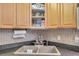 Modern corner sink with tile backsplash in the kitchen at 1550 S Belcher Rd # 117, Clearwater, FL 33764