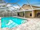 Refreshing pool with covered patio and adjacent home at 15505 Granby Pl, Tampa, FL 33624