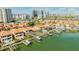 Aerial view of waterfront home with private boat dock at 1613 Sand Key Estates Ct, Clearwater, FL 33767
