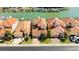 Aerial view of waterfront homes with private boat docks at 1613 Sand Key Estates Ct, Clearwater, FL 33767