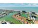 Aerial view of waterfront home and surrounding community at 1613 Sand Key Estates Ct, Clearwater, FL 33767