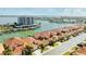 Aerial view of waterfront home with private boat dock at 1613 Sand Key Estates Ct, Clearwater, FL 33767