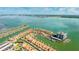 Aerial view of waterfront home with boat slips and nearby high-rise at 1613 Sand Key Estates Ct, Clearwater, FL 33767