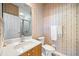 Updated bathroom with walk-in shower and grab bars at 1613 Sand Key Estates Ct, Clearwater, FL 33767