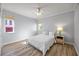 Bright bedroom with light wood floors and window at 1613 Sand Key Estates Ct, Clearwater, FL 33767