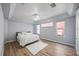 Bright bedroom with light gray walls and wood-look floors at 1613 Sand Key Estates Ct, Clearwater, FL 33767