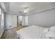 Main bedroom with ensuite bathroom and wood-look floors at 1613 Sand Key Estates Ct, Clearwater, FL 33767