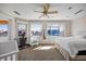 Bedroom with water views and ceiling fan at 1613 Sand Key Estates Ct, Clearwater, FL 33767