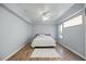 Spacious bedroom featuring light gray walls and wood-look floors at 1613 Sand Key Estates Ct, Clearwater, FL 33767