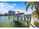 Private boat lift on a spacious dock at 1613 Sand Key Estates Ct, Clearwater, FL 33767