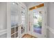 Bright entryway with double French doors and a glass front door at 1613 Sand Key Estates Ct, Clearwater, FL 33767