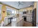 Modern kitchen with granite countertops and stainless steel appliances at 1613 Sand Key Estates Ct, Clearwater, FL 33767