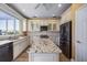 Spacious kitchen with granite island and stainless steel appliances at 1613 Sand Key Estates Ct, Clearwater, FL 33767
